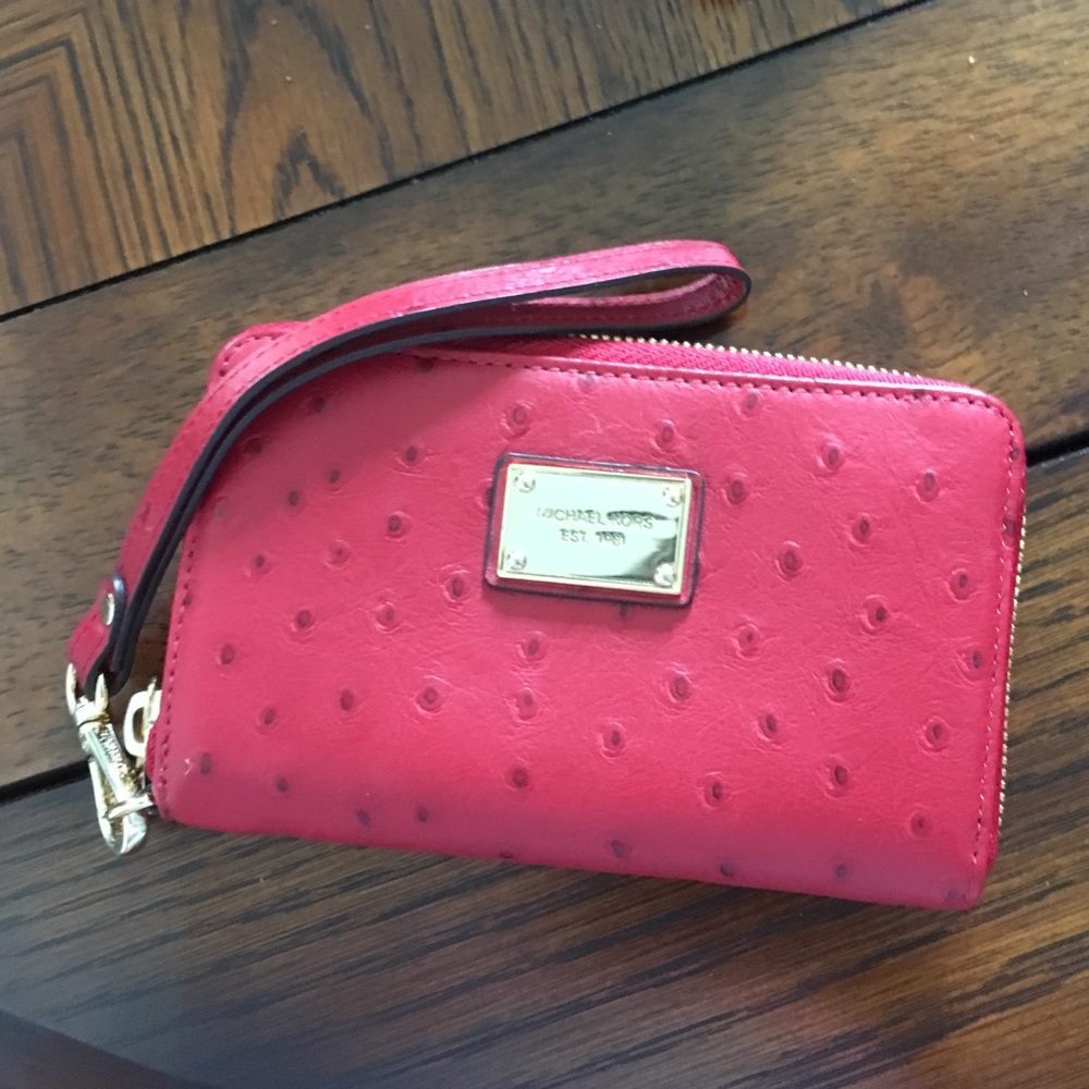 3 1/2 inch by 6 inch red Michael Kors wristlet